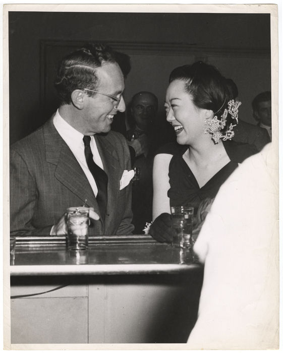 [man and woman at bar, laughing]