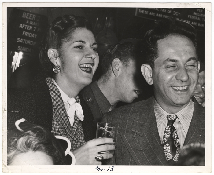 [people in a bar, laughing]