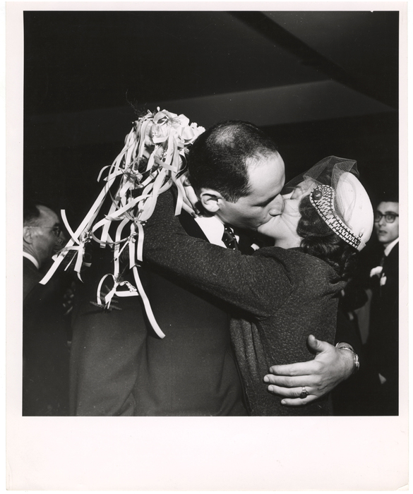 [Bride and groom kissing]