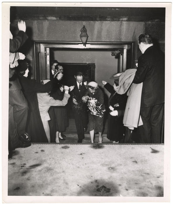 [Bride and groom leaving wedding ceremony]