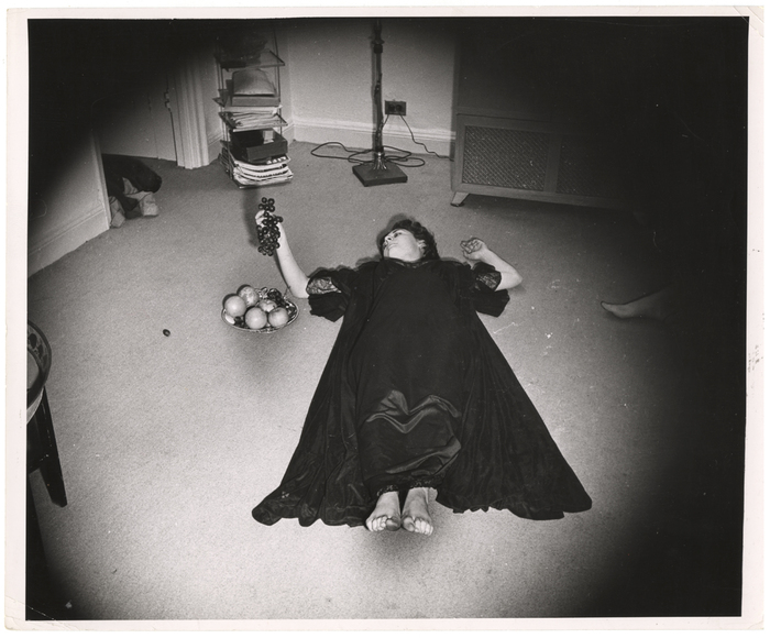 [woman holding grapes]