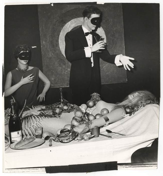 [Masked mannequins and fruit-covered mannequin]
