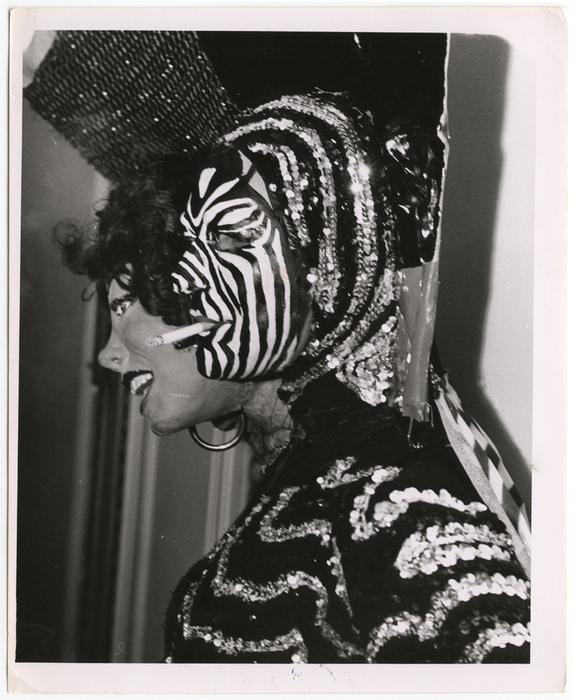 [man wearing two headed costume smoking]