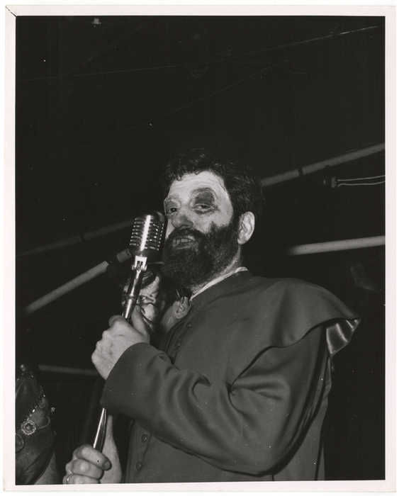 [costumed man with microphone]