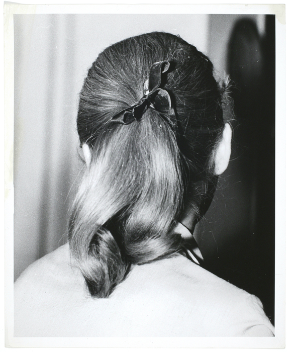 [portrait of a woman, back of head]