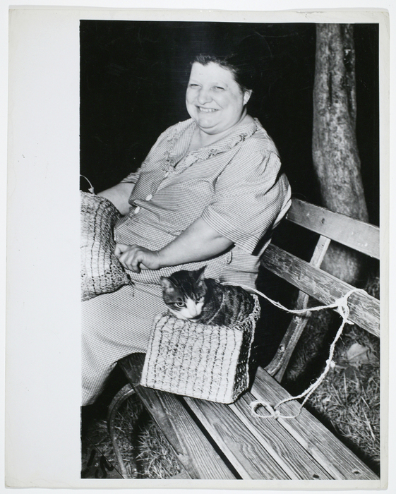[woman and cat on bench]