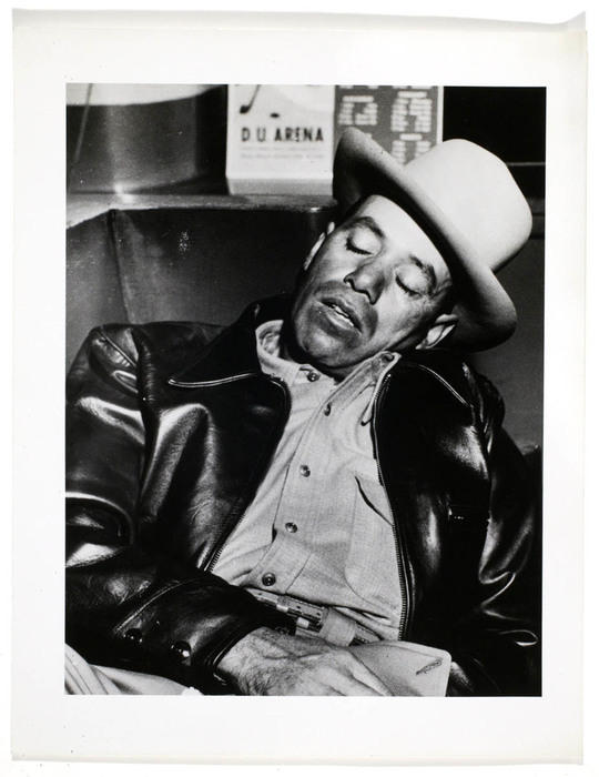 [Man sleeping on bench]