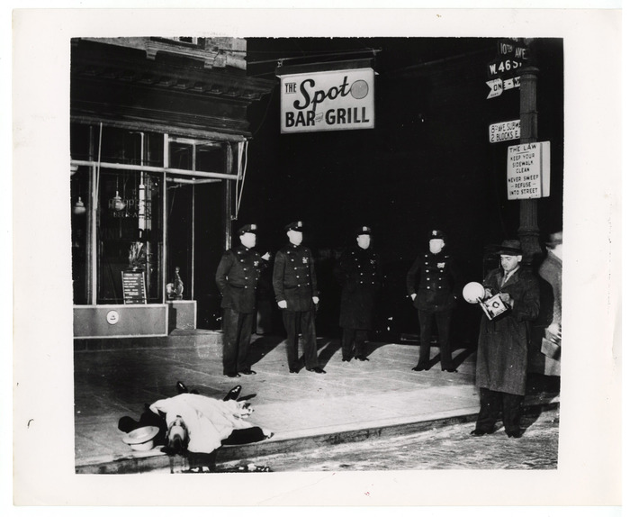 [Weegee and police with body of longshoreman David “the Beetle” Beadle outside the Spot Bar and Grill, New York]