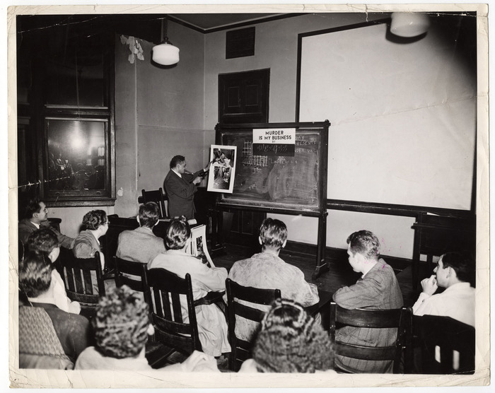 [Weegee delivering lecture called "Murder is My Business"]