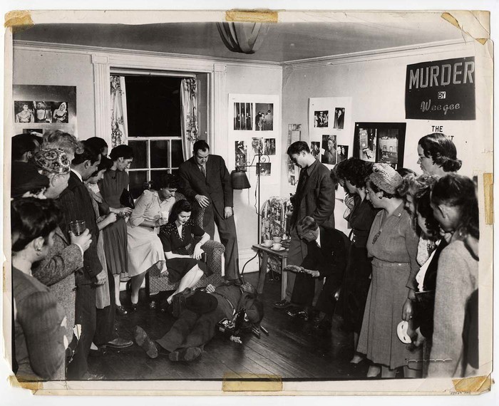 [Weegee playing dead for audience at "Murder by Weegee," The Gamut Arts Club, New York]