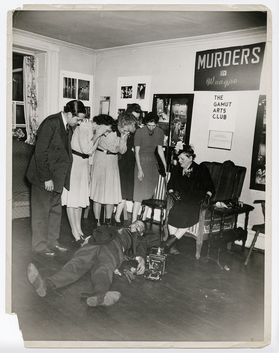 [Weegee playing dead for audience at "Murder by Weegee," The Gamut Arts Club, New York]