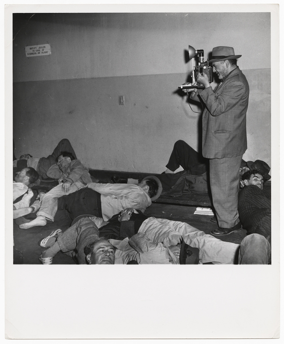 [Weegee photographing for the film "Journey Into Light"]
