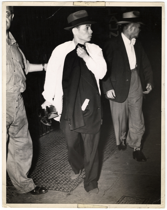 [men on sidewalk at night]