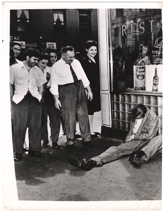 [crowd laughing at drunk]