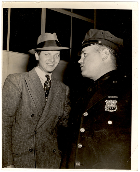 [Man and police officer] | 1International Center of Photography