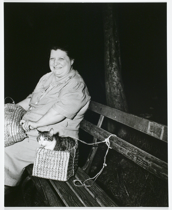 [woman and cat on bench]