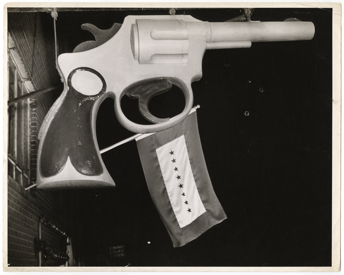 [Banner on the Headquarters Press Building with eight stars representing eight reporters serving in the Army and Navy, New York]
