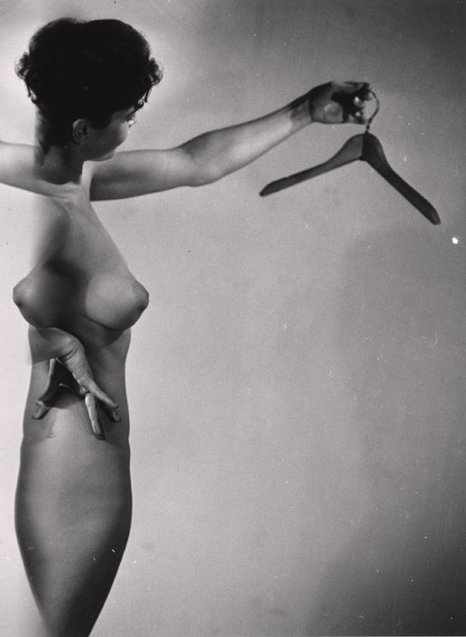 [Female nude with clothes hanger distortion]