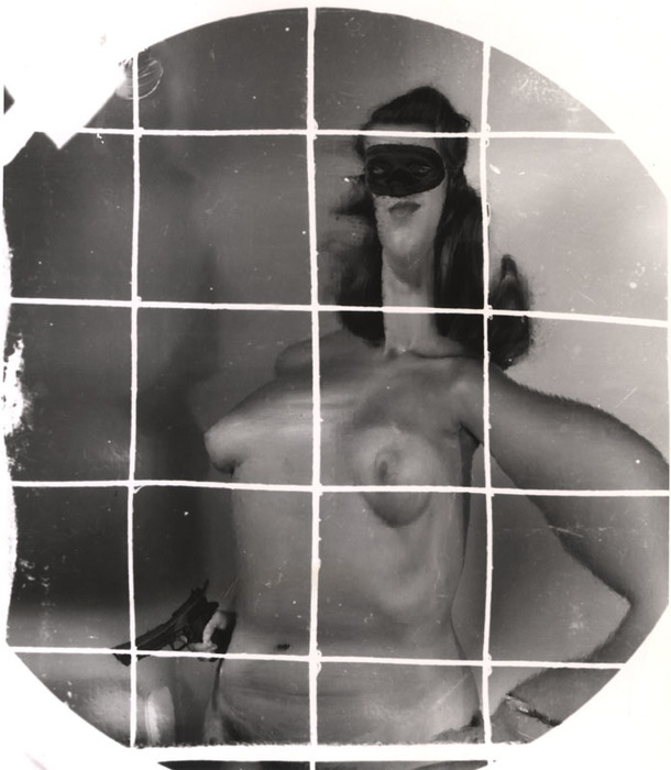[Masked female nude with gun distortion]