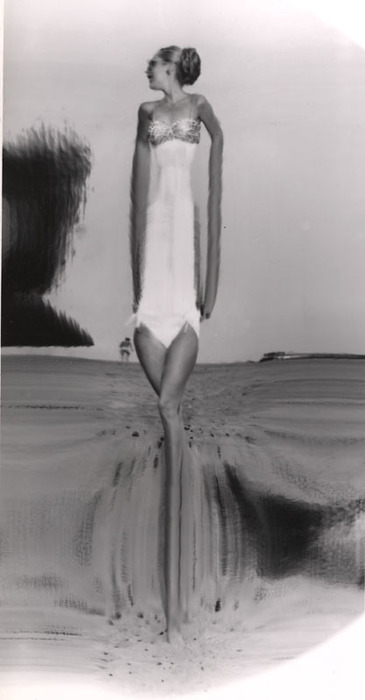 Blonde on beach, with sunglasses