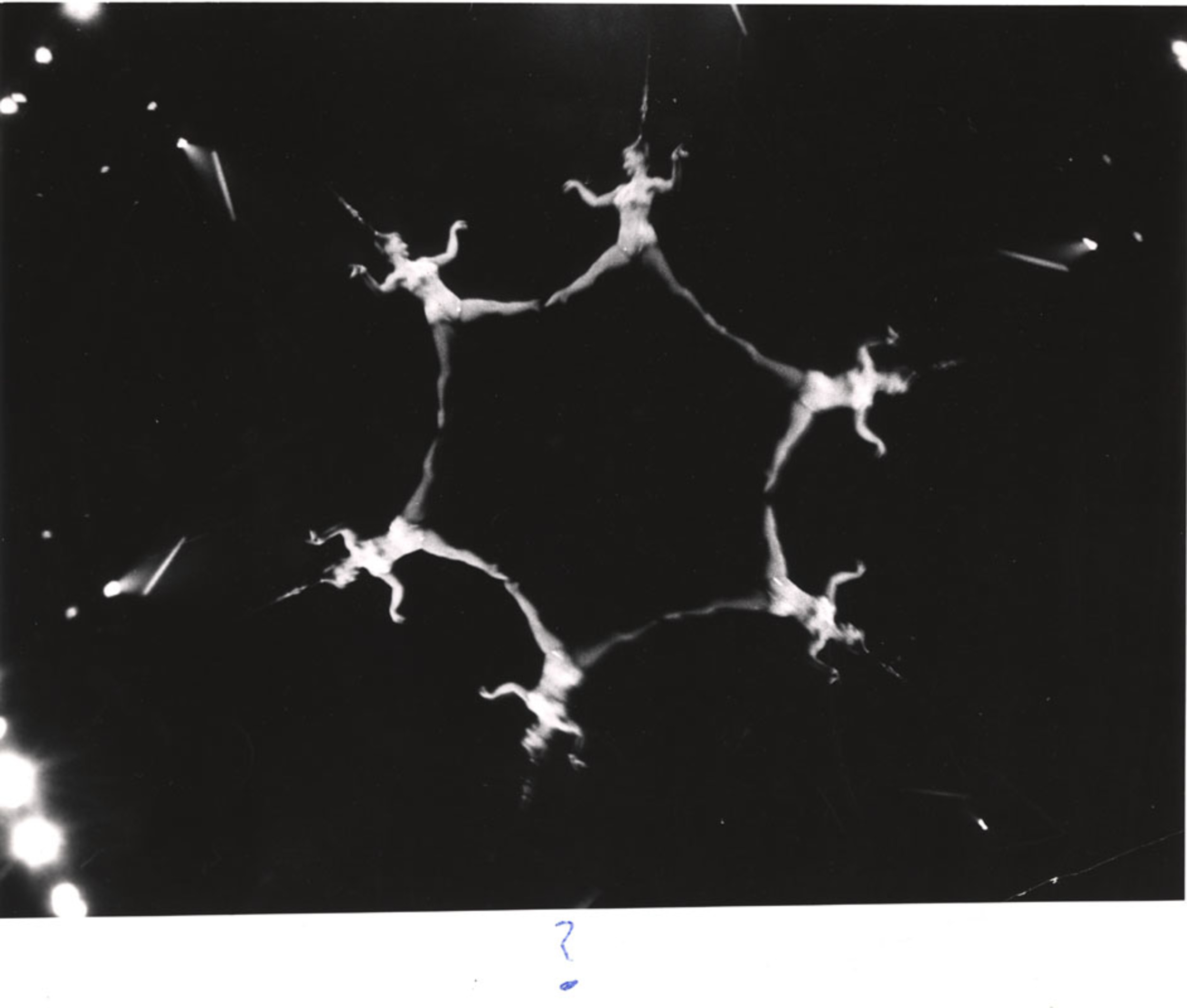 ? (Acrobat, hanging from her hair) International Center of Photography