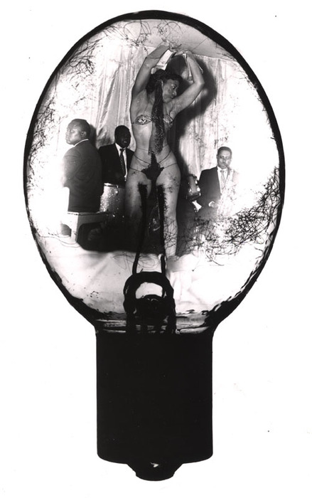[Erotic dancer and band in a bulb]