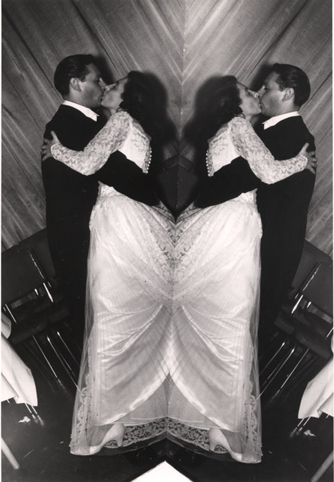 Bride and bridegroom kissing