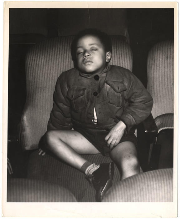 Boy sleeping in a movie theatre