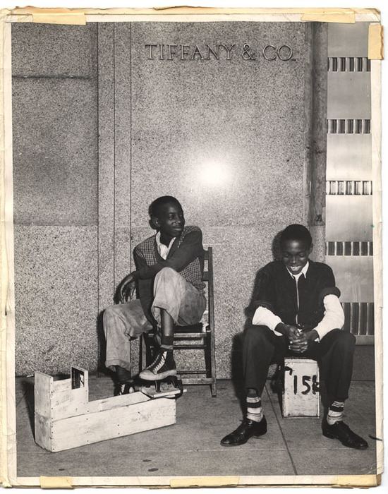 [Two young shoe shiners in front of Tiffany's, New York]