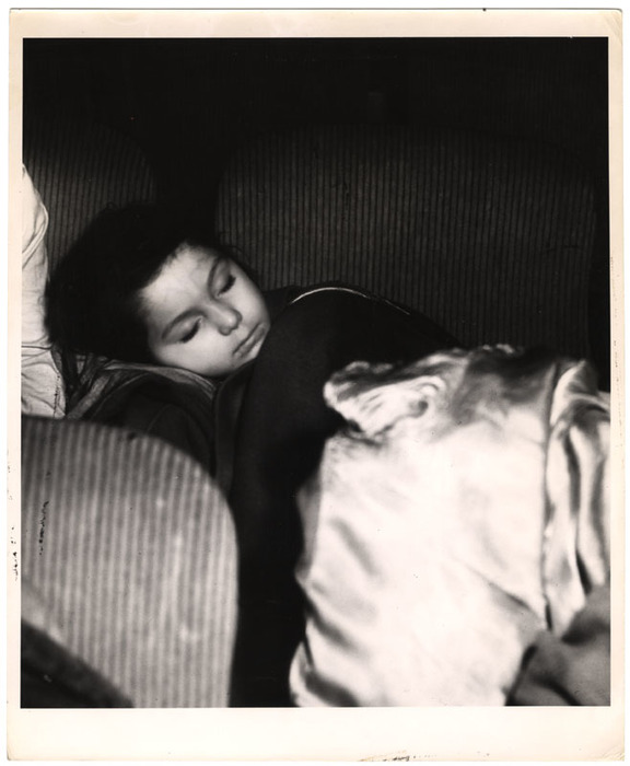 Girl sleeping in a movie theatre