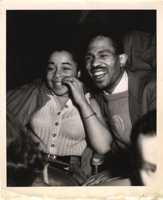 Woman and man laughing in a movie theater