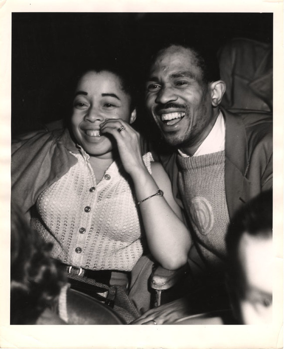 Woman and man laughing in a movie theater