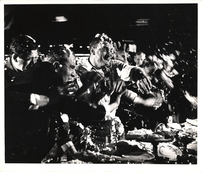 [Cream pie fight in the War Room on the set of "Dr. Strangelove or: How I Learned to Stop Worrying and Love the Bomb"]