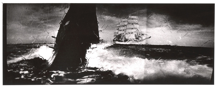 [Widescreen image of whale and sailboat Christian Raditch in Louis de Rochemont's film "Windjammer"]