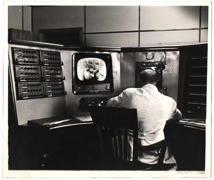 Man sitting at a video booth