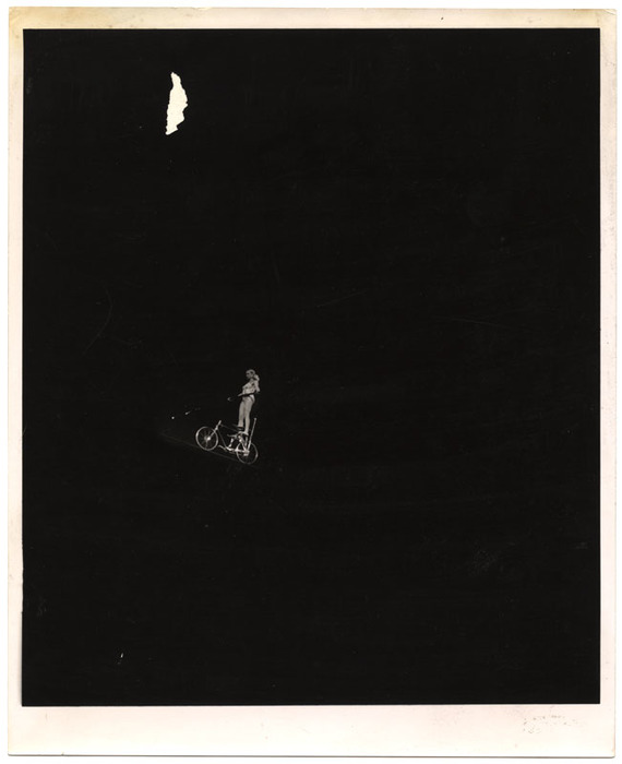 Acrobat performing on a bicycle