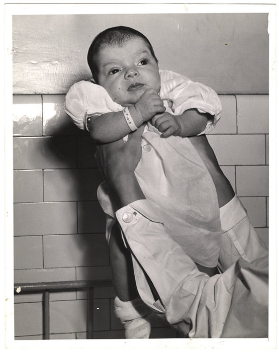 [Nurse holding two-week-old abandoned girl, Foundling Home, New York]