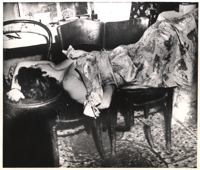 [Performer sleeping on chairs in dressing room]