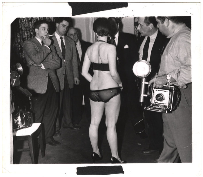 [Showgirl posing for press photographers]