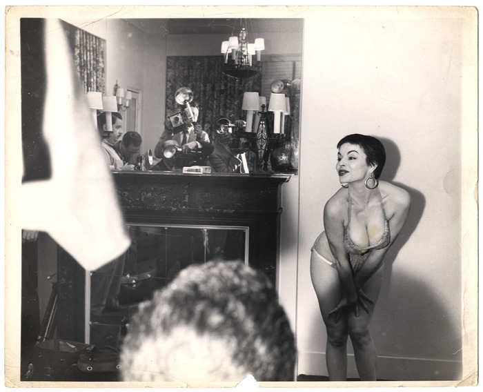 [Showgirl posing for press photographers]