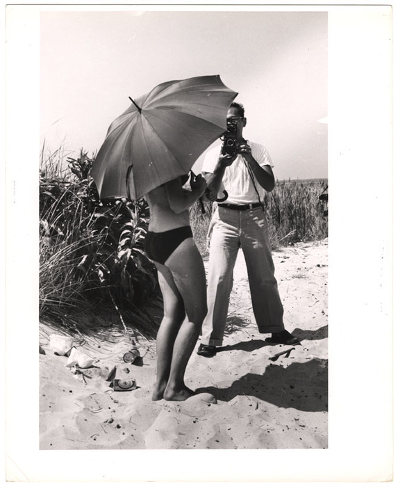 [Model and photographer on the beach]
