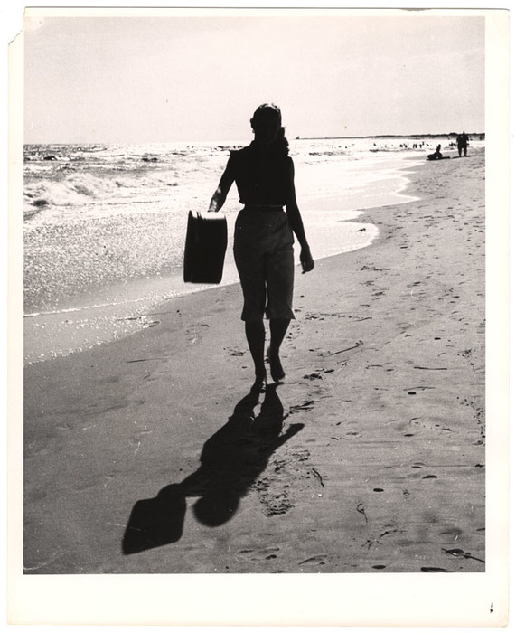 Model walking on the beach