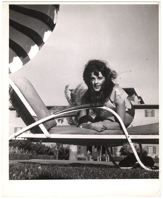 Model on lawn chair