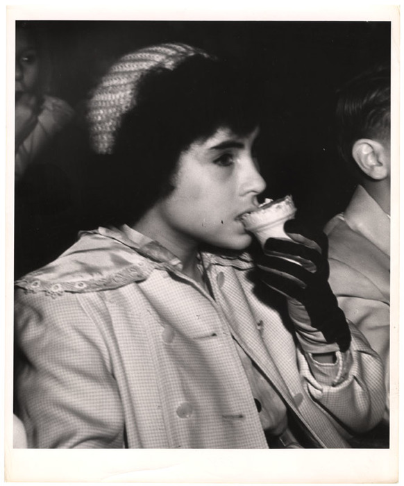 Girl eating ice cream in movie theatre