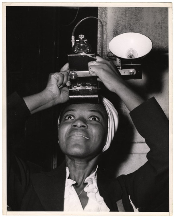 Woman taking a photograph