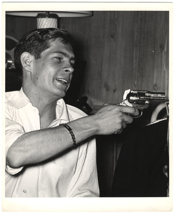 [Johnnie Ray holding gun]