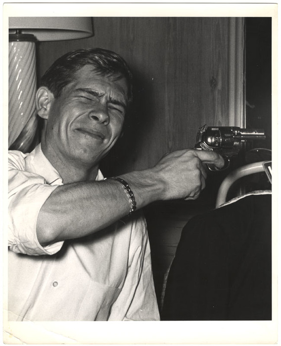 [Johnnie Ray holding gun]
