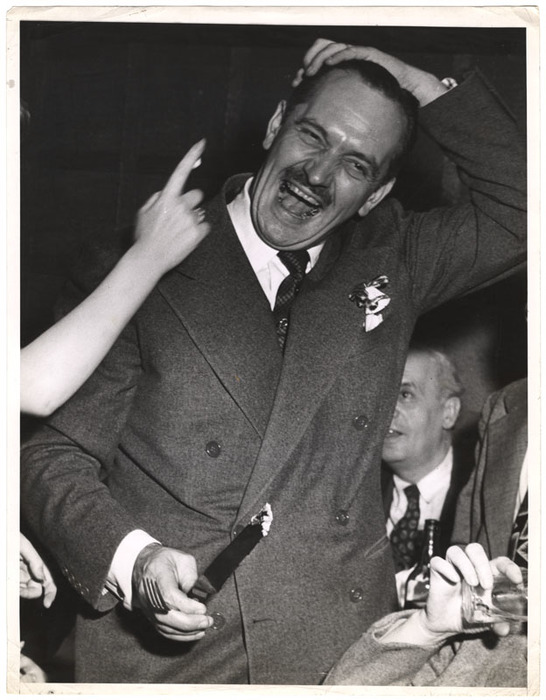 [Fredric March laughing at cake smeared in his hair at afterparty for "A Bell for Adano," Adano Cafe, New York]