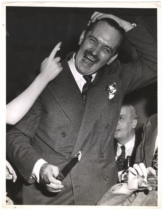 [Fredric March laughing at cake smeared in his hair at afterparty for "A Bell for Adano," Adano Cafe, New York]