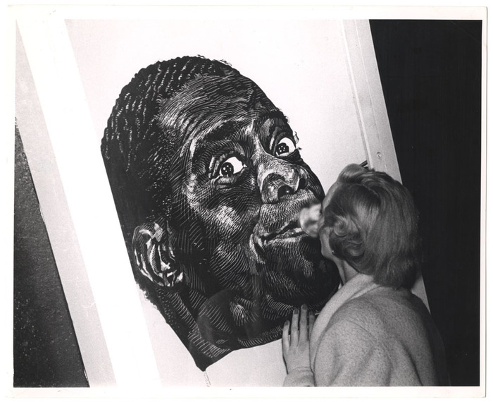 [Woman with image of Louis Armstrong]